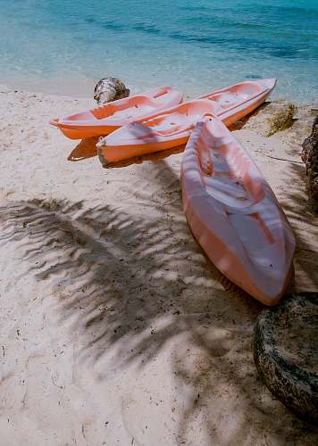 alona beach three empty kayaks philippines